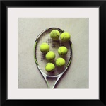 Tennis racquet and tennis balls.