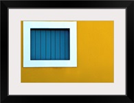 Window on yellow wall.