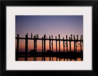 People walking on Ubein Bridge at Sunset, Mandalay, Burma