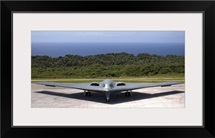 A B2 Spirit stealth bomber waits on the flightline