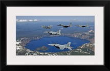 A five-ship aircraft formation flies over Crater Lake, Oregon