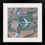 A KC-135R Stratotanker refuels four F-15 Eagles over Oregon