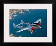 A Lockheed P 38 Lightning fighter aircraft in flight