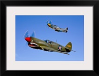 A P 40E Warhawk and a P 51D Mustang Kimberly Kaye in flight