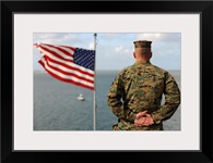 A soldier stands at attention on USS Bonhomme Richard