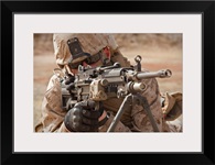 A squad automatic weapon gunner provides security
