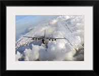 An AC 130U gunship jettisons flares over Florida