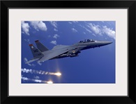 An Air Force F15E Strike Eagle fires flares off the coast of Guam