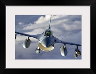 An F16 Fighting Falcon soars through the sky