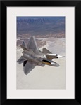 Two F-22 Raptors maneuver while on a training mission over New Mexico
