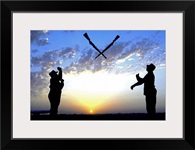 Two Staff Sergeants perform Overs maneuver while practicing drill for Base Honor Guard