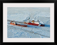 USCG Healy breaks ice around a Russian-flagged tanker south of Nome, Alaska