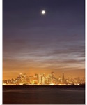 Moon setting over San Francisco on hazy December evening, taken from Treasure Island.