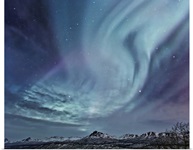 Northern Lights (aurora borealis) over the Talkeetna Mountains on a clear evening