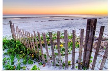 A beach fence at sunset on Hilton Head Island, South Carolina.
