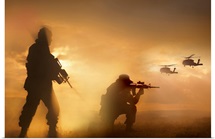 U.S. Special Forces provide security for two incoming UH-60 Black Hawk helicopters