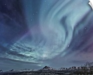 Northern Lights (aurora borealis) over the Talkeetna Mountains on a clear evening
