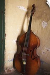 A double bass in the corner of a room