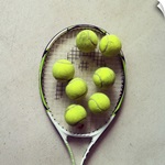 Tennis racquet and tennis balls.