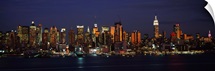 Skyscrapers lit up at night in a city, Manhattan, New York City, New York State