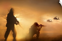 U.S. Special Forces provide security for two incoming UH-60 Black Hawk helicopters