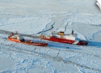 USCG Healy breaks ice around a Russian-flagged tanker south of Nome, Alaska