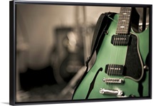 Metallic green hollow-body electric guitar