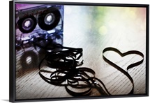 Spilled cassette tape symbolizing the love of old school mix tapes and all things analog