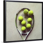 Tennis racquet and tennis balls.