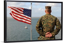 A soldier stands at attention on USS Bonhomme Richard