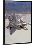 Two F-22 Raptors maneuver while on a training mission over New Mexico