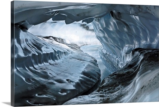 A water channel cuts a tunnel through the ice of the Matanuska Glacier