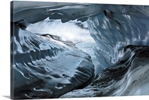 A water channel cuts a tunnel through the ice of the Matanuska Glacier