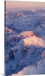 Aerial view of the Chugach Mountain range with sunrise alpenglow hitting the peaks