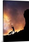 Hawaii, Silhouette Of A Woman Stretching On A Mountain Top At Sunset