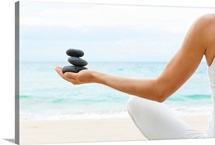 Hawaii, Woman Holding Stack Of Stones In Hands