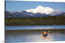 Man paddling a Klepper kayak on Byers Lake at Denali State Park with Mt. McKinley