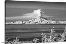 Mountain erupts with a cloud of ash