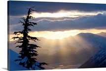Sun rays shinning through clouds at sunset along Turnagain Arm