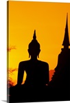 Thailand, Sukhothai, Buddha And Temple Silhouetted At Sunset