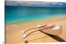 White Outrigger Canoe On Shoreline With Shadow, Calm Turquoise Water