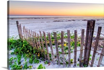 A beach fence at sunset on Hilton Head Island, South Carolina.