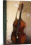 A double bass in the corner of a room