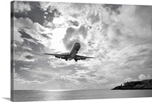 An airliner comes in for a landing in St Maarten, Netherlands Antilles.