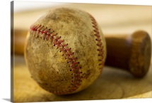 Antique baseball with baseball bat