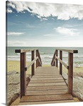 Beach with wooden pier in Spain.