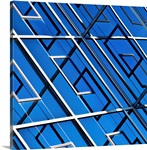 Blue, abstract and geometric reflection on  facade of modern building.