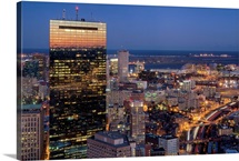 Building of Boston with light trails on road at night in Boston.