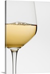Close up of glass of white wine on white background