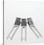 Close-up of three hair clips